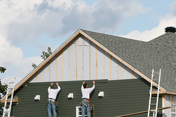 Professional Siding technician working in Bath, IN